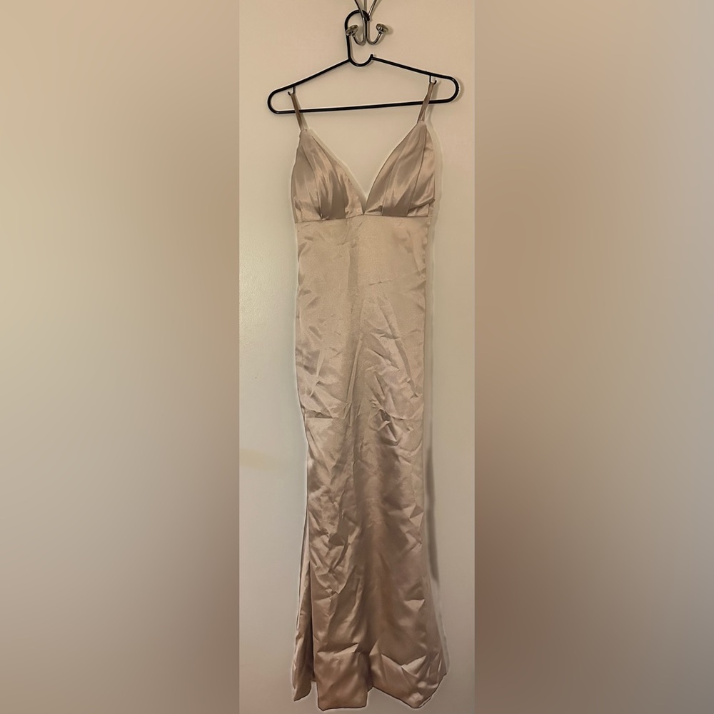New, never worn. Gold polyester maxi dress/gown. Perfect for an occasion.